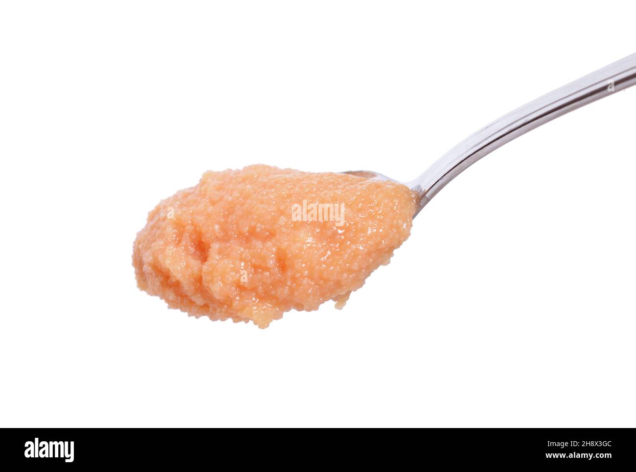 Pollock caviar in the spoon isolated on white background. Stock Photo