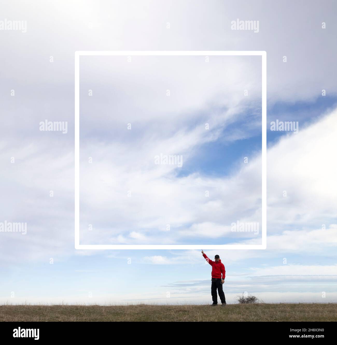 A man standing in beautiful nature and holding a text box Stock Photo ...