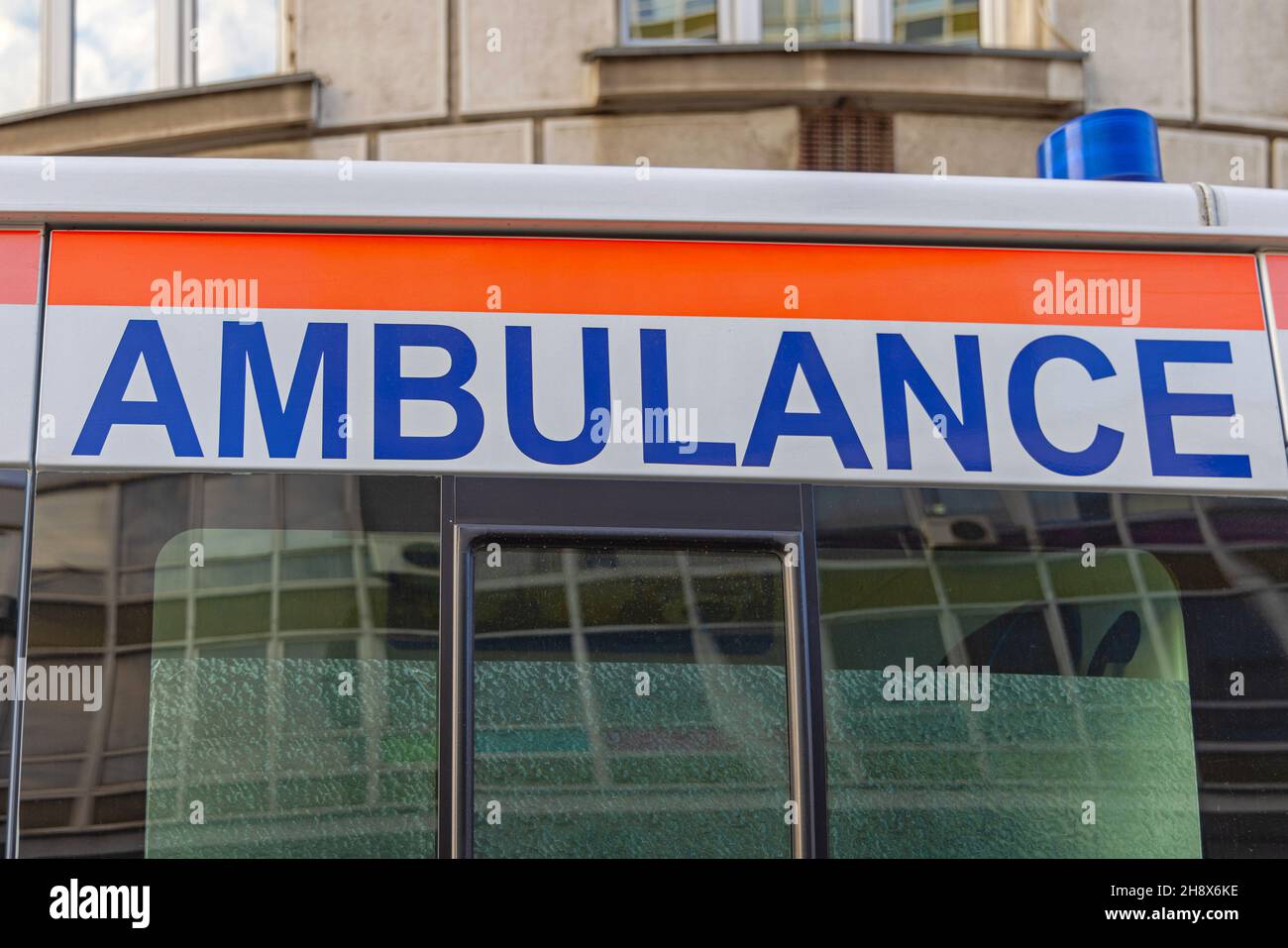 Ambulance Sign at Emergency Vehicle Van Side Door Stock Photo