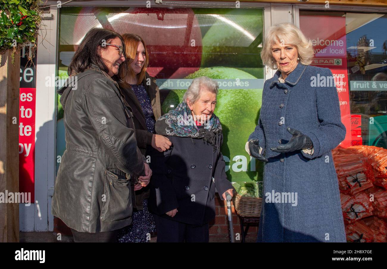 The Duchess of Cornwall meets (left to right) Judith Tinnion (wife), Clare Tinnion (daughter) and mother Irene Jones, 95, the family of independent Spar shop owner Derek Tinnion during a visit to his store in Devizes, Wilsthire, to thank them and staff for their tireless work in supporting the Devizes community for over 60 years, especially during the pandemic. Picture date: Thursday December 2, 2021. Stock Photo