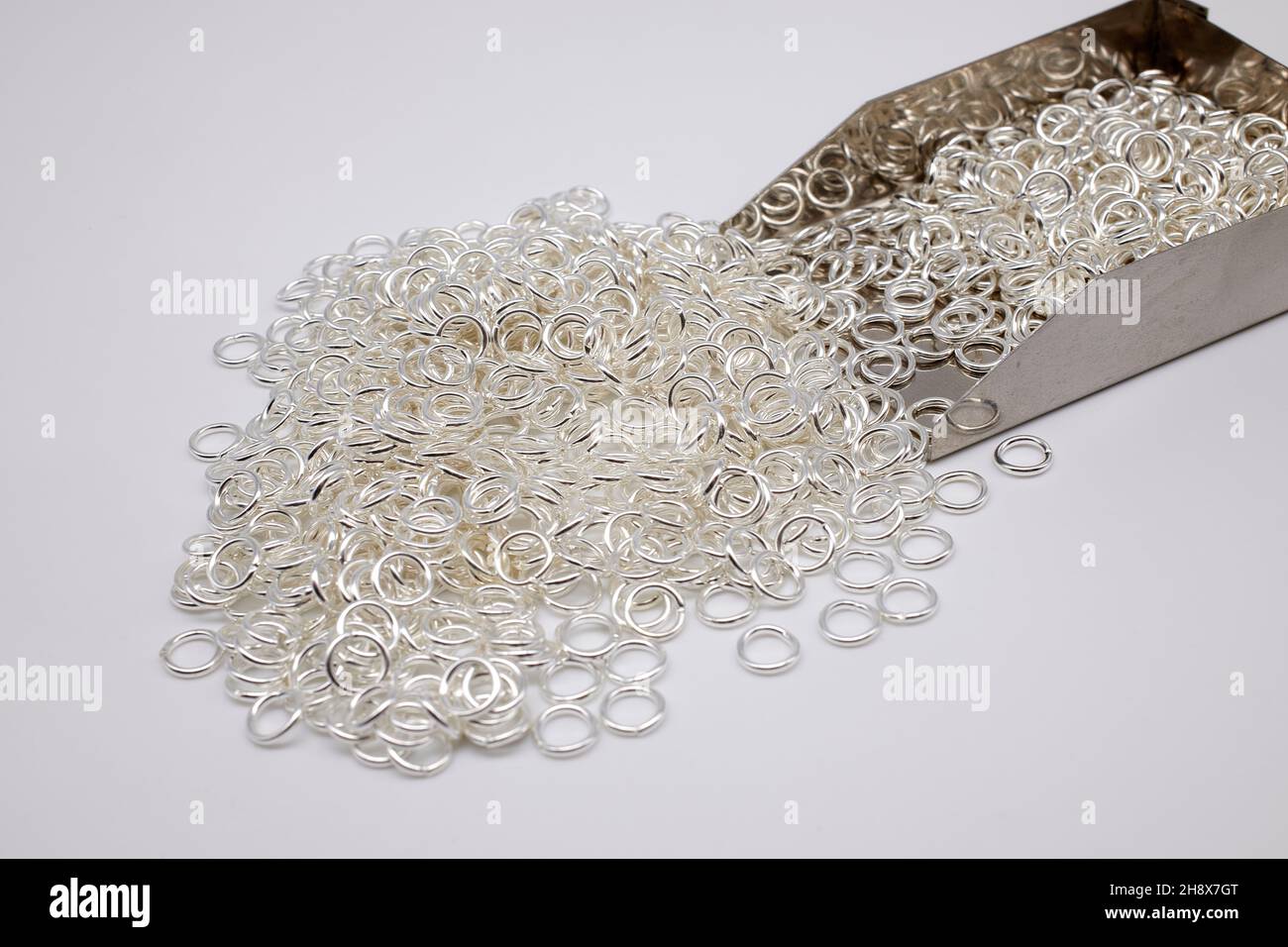 Silver jump rings for jewellery making Stock Photo Alamy