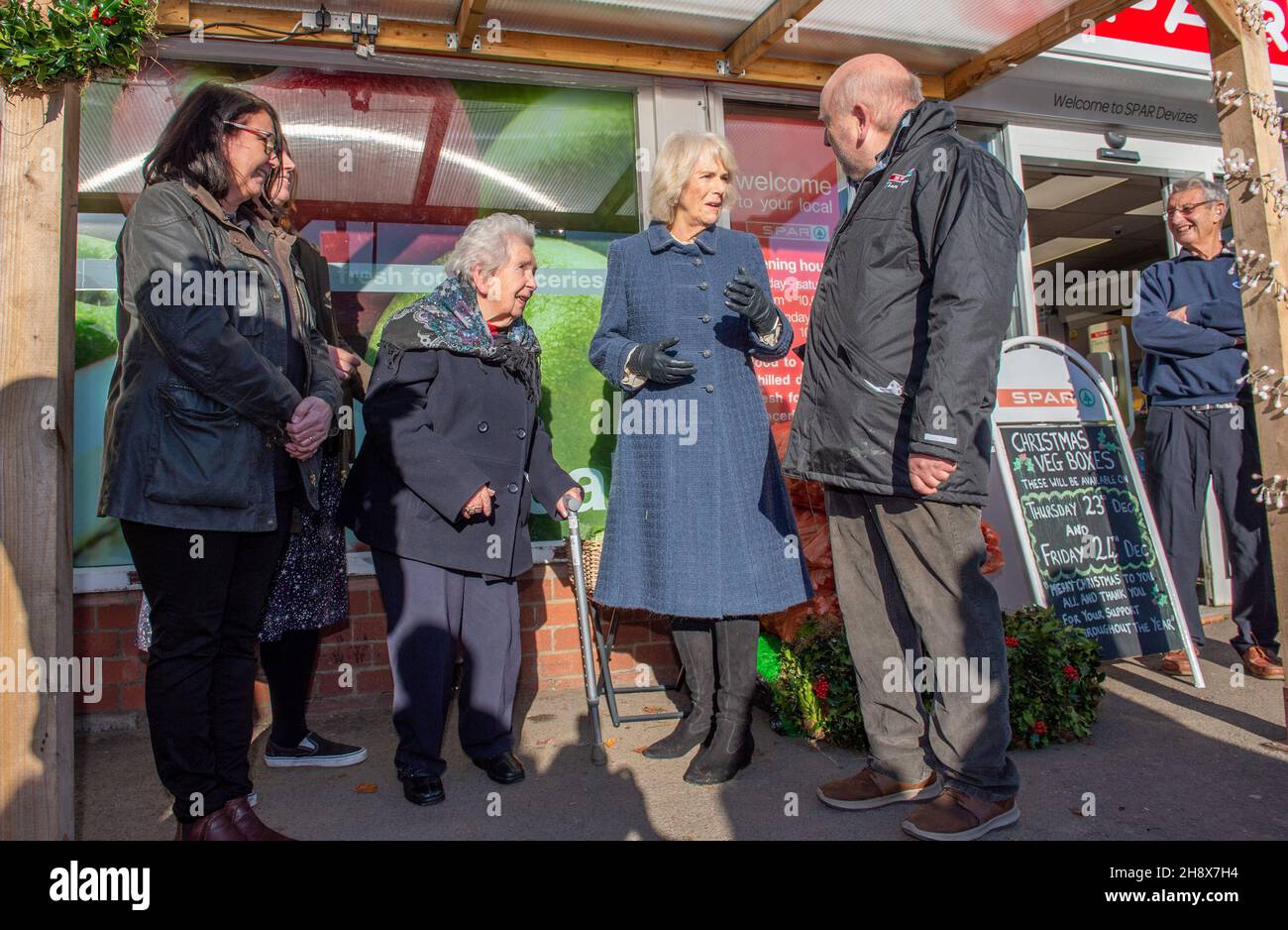 The Duchess of Cornwall meets independent Spar shop owner Derek Tinnion (right) and his family (left to right) wife Judith Tinnion, daughter Clare Tinnion (hidden) and mother Irene Jones, 95, during a visit to his store in Devizes, Wilsthire, to thank them and staff for their tireless work in supporting the Devizes community for over 60 years, especially during the pandemic. Picture date: Thursday December 2, 2021. Stock Photo