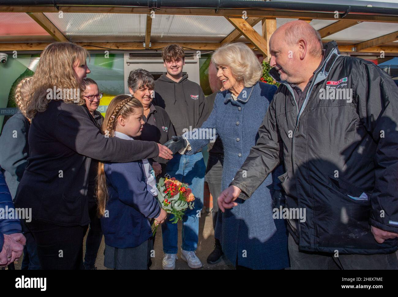 The Duchess of Cornwall meets independent Spar shop owner Derek Tinnion (right) and his family during a visit to his store in Devizes, Wilsthire, to thank them and staff for their tireless work in supporting the Devizes community for over 60 years, especially during the pandemic. Picture date: Thursday December 2, 2021. Stock Photo