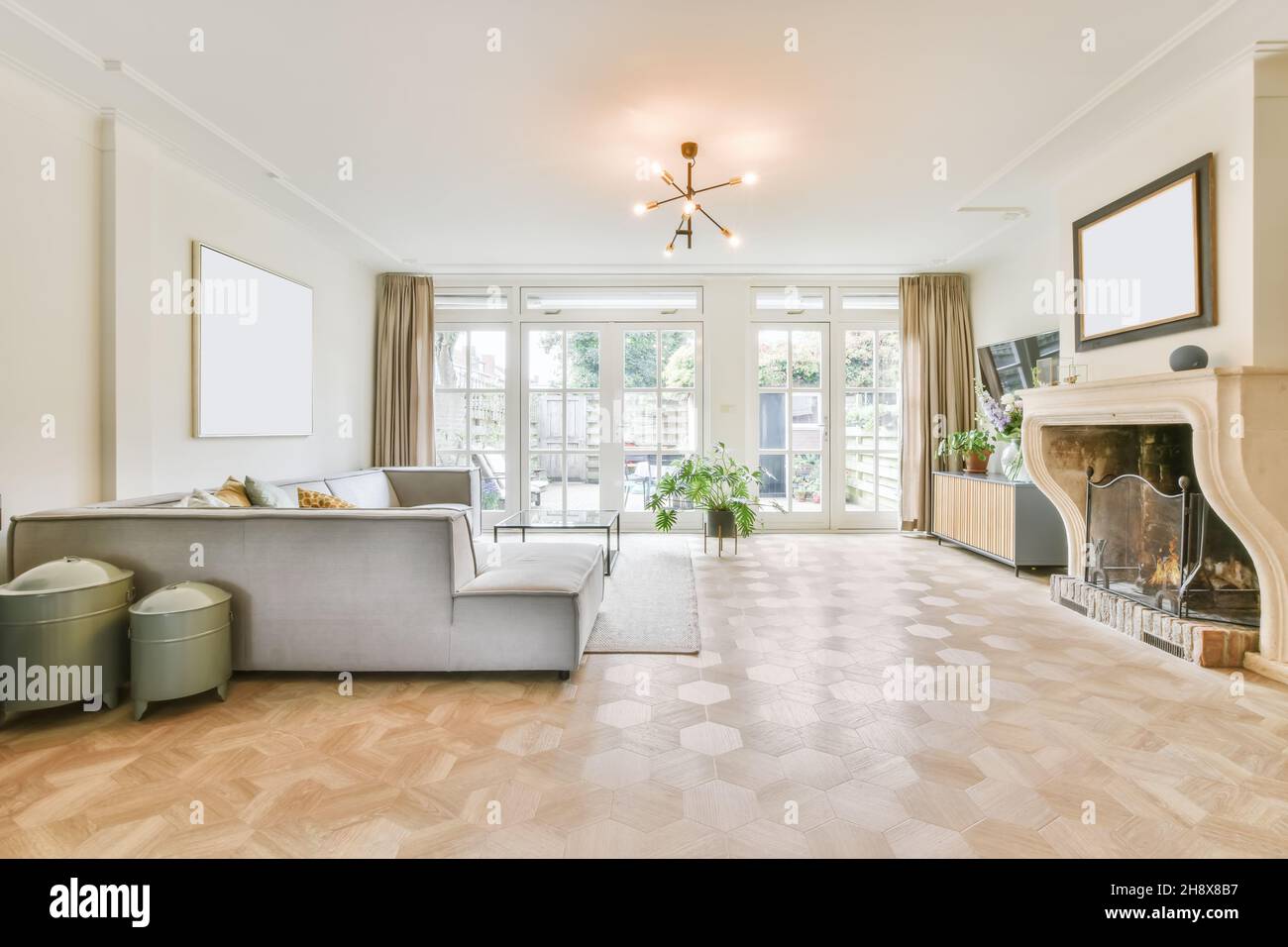A breathtaking living room with a luxury elegant gray sofa Stock Photo