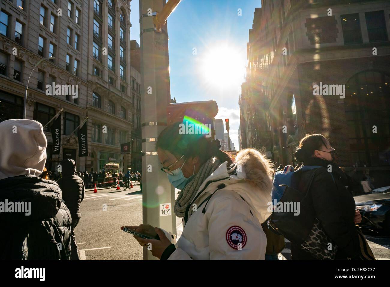 Shopper with her Canada Goose parka in the Soho neighborhood of New York on  Saturday, November 27, 2021 during the Black Friday weekend. Despite supply  chain issues and new Covid variants analysts
