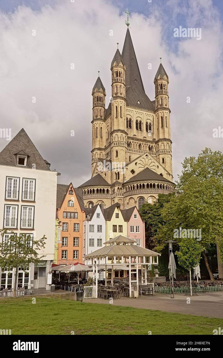 Great Saint martin church and facades of historical houses, now housing bars and restaurants in Cologne Stock Photo