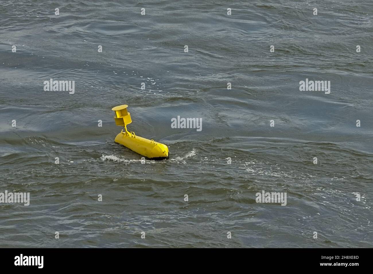 Yellow measurement buoy in the water Stock Photo