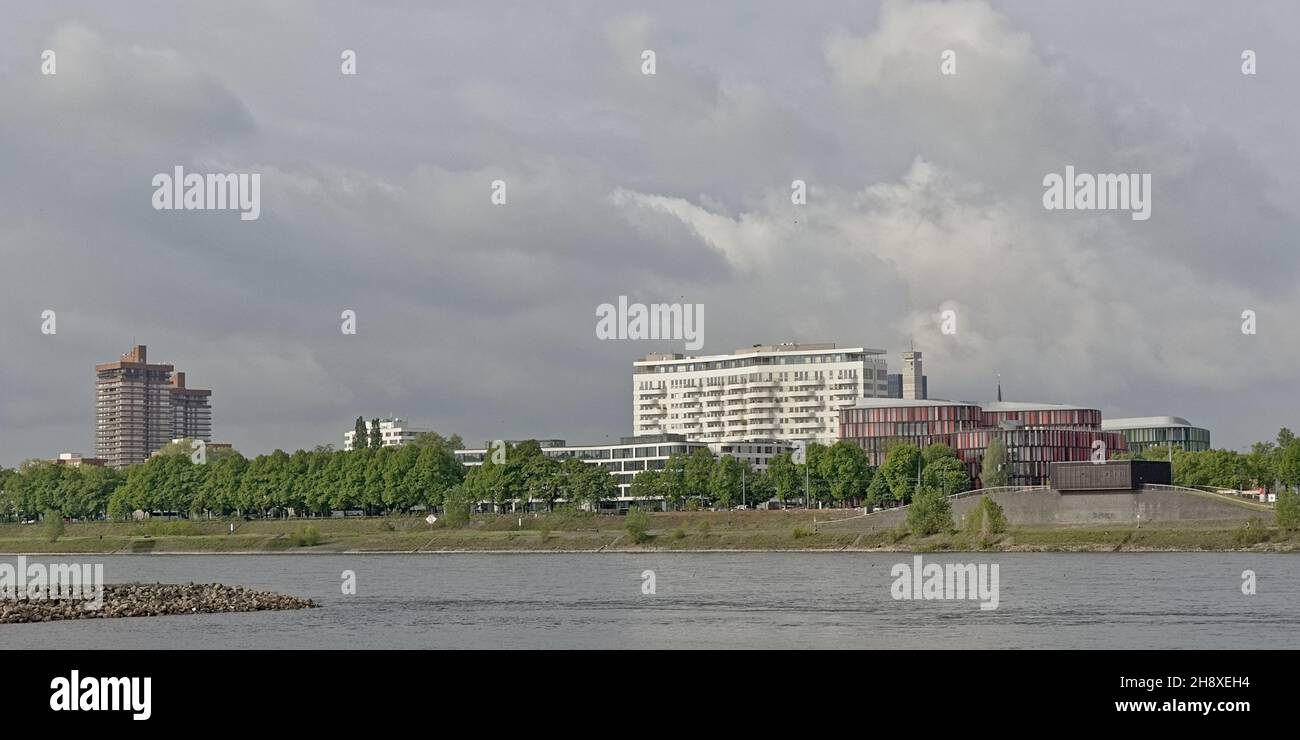 Buildings along river Rhine on a cludy day in Cologne, Germany Stock Photo