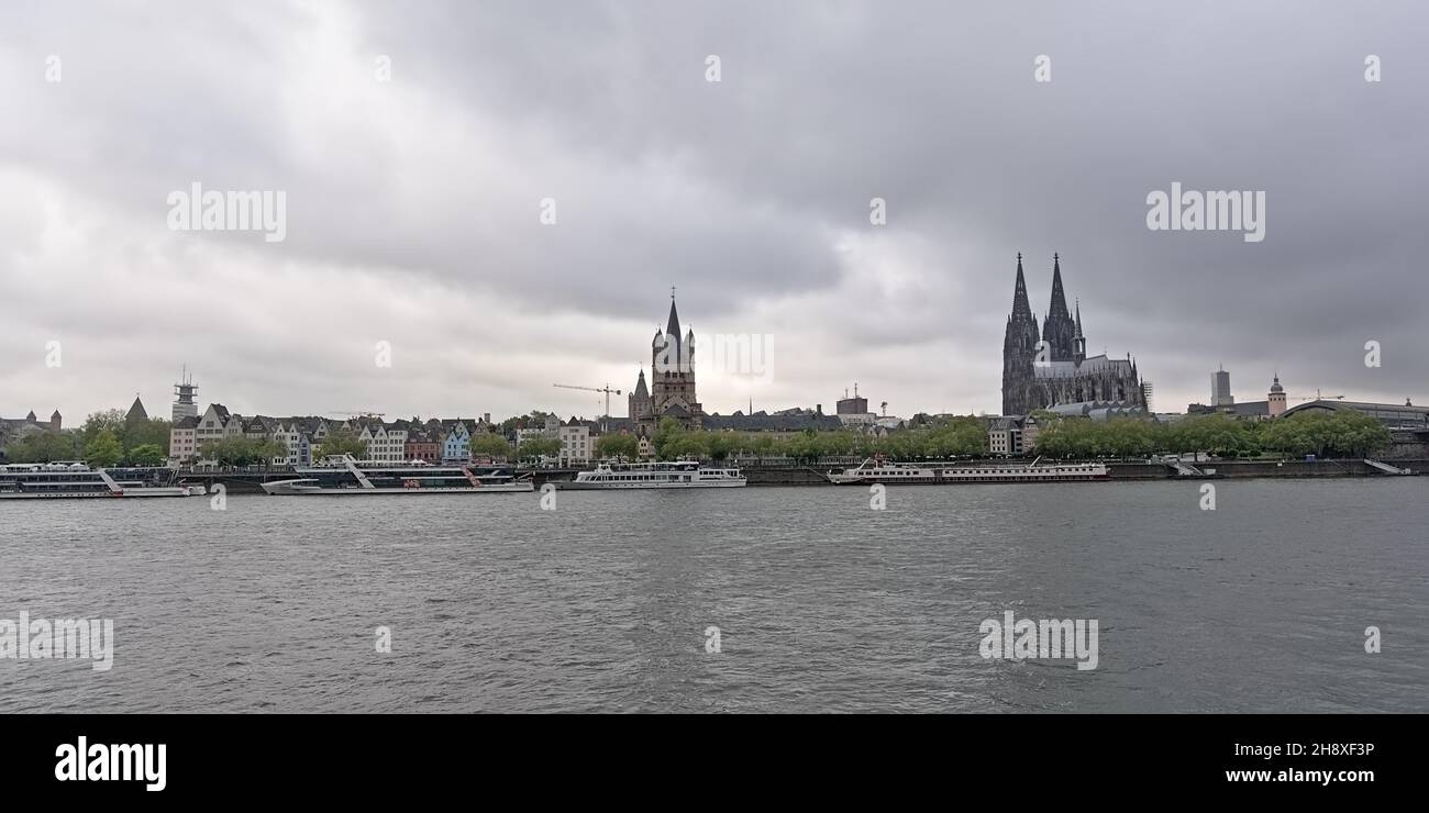 View on Cologne from across river rhine, with cathedral and Great Saint martin church Stock Photo