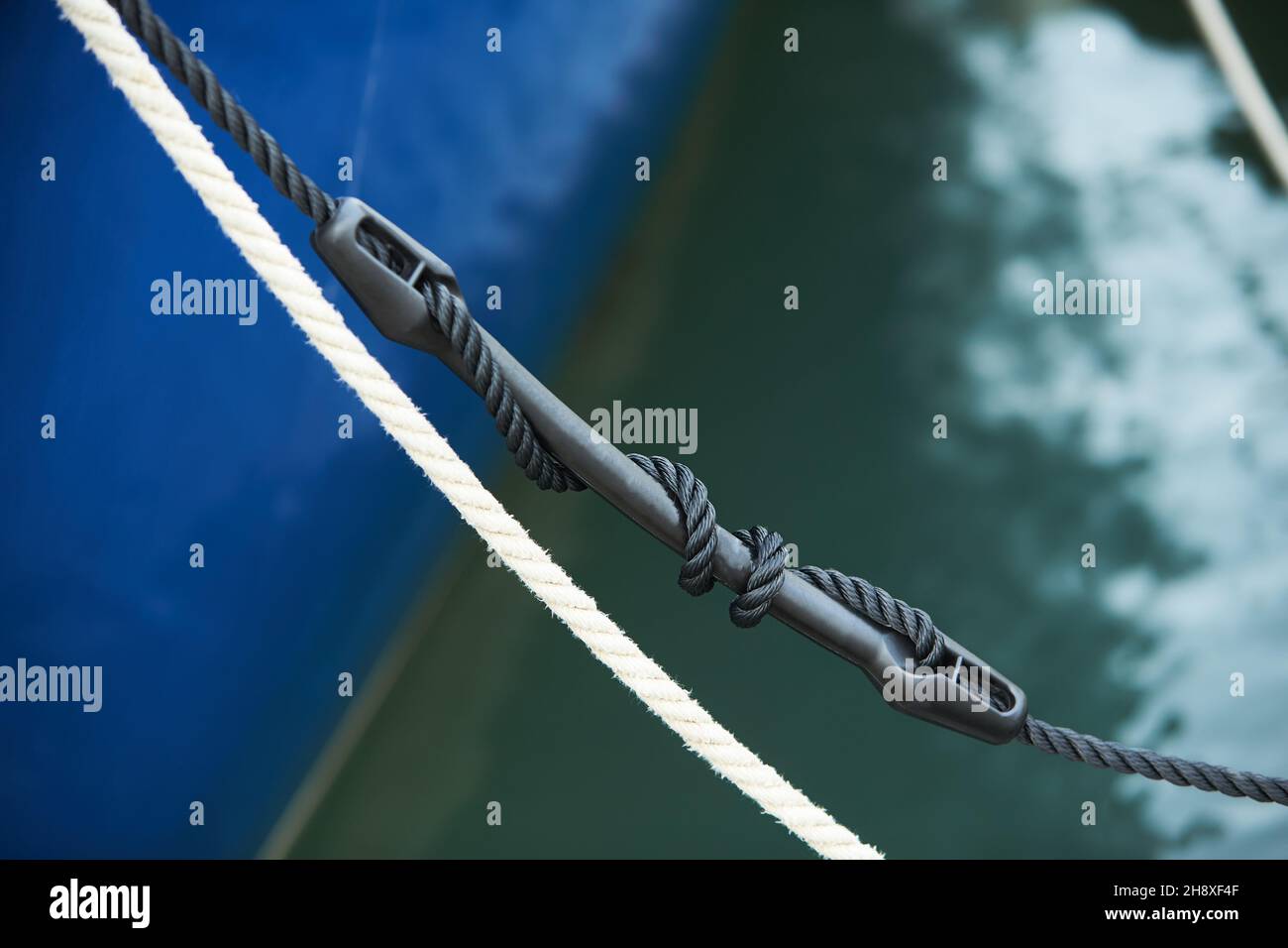 Mooring compensator of rope tension. Detail of boat Stock Photo Alamy