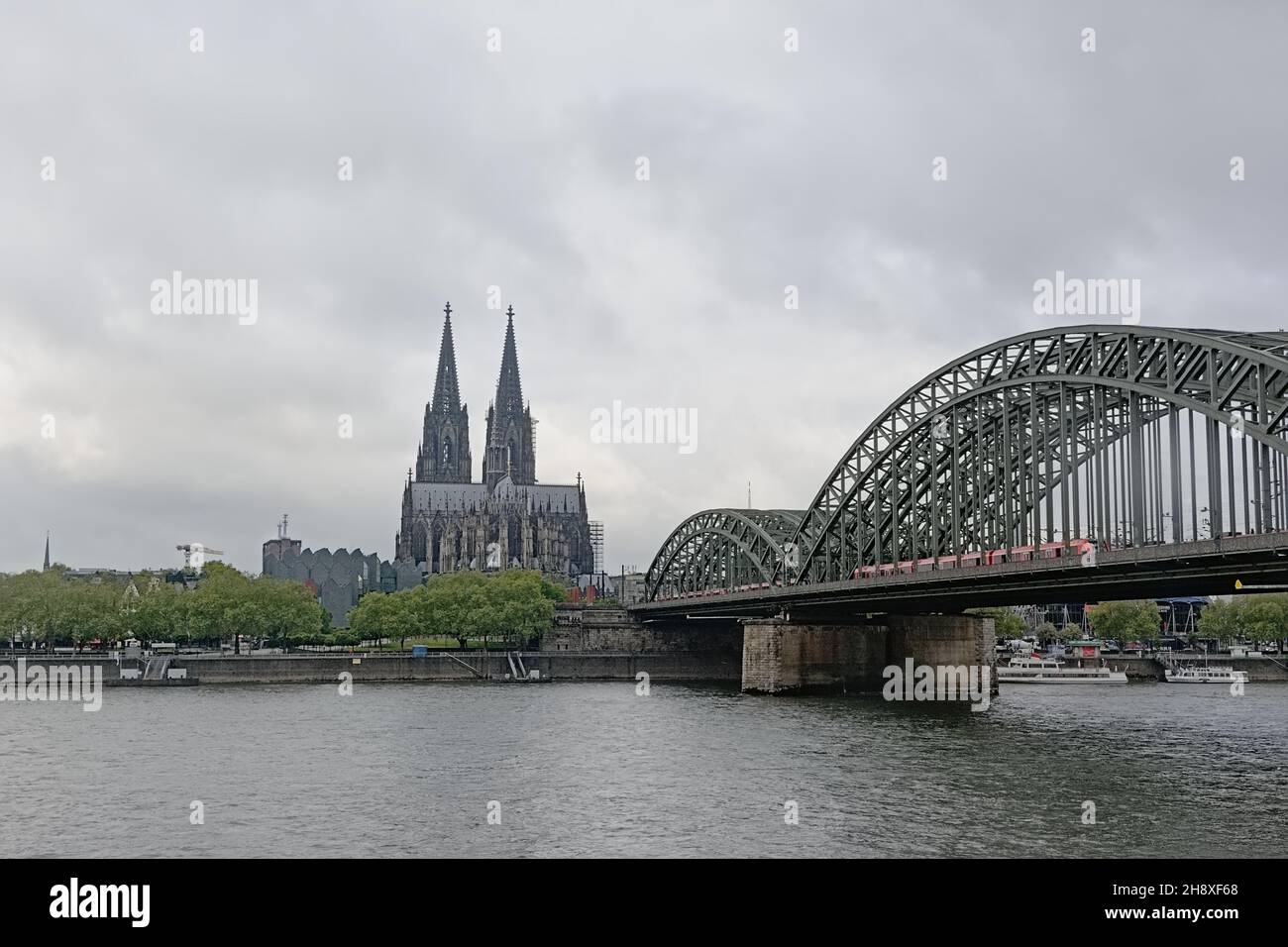 Cologne cathedral and Hohenzollern bridge over river Rhine Stock Photo
