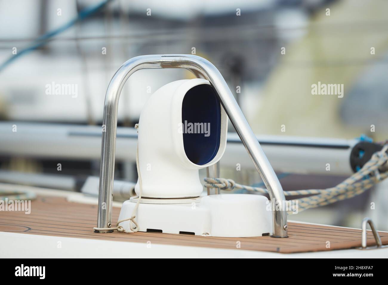 Details of stainless steel air intake on a teak deck of a luxury