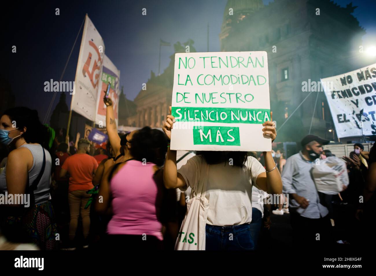 BUENOS AIRES, ARGENTINA - Mar 08, 2021: Woman holding a protest poster on International march for women's day in Buenos Aires, Argentina Stock Photo