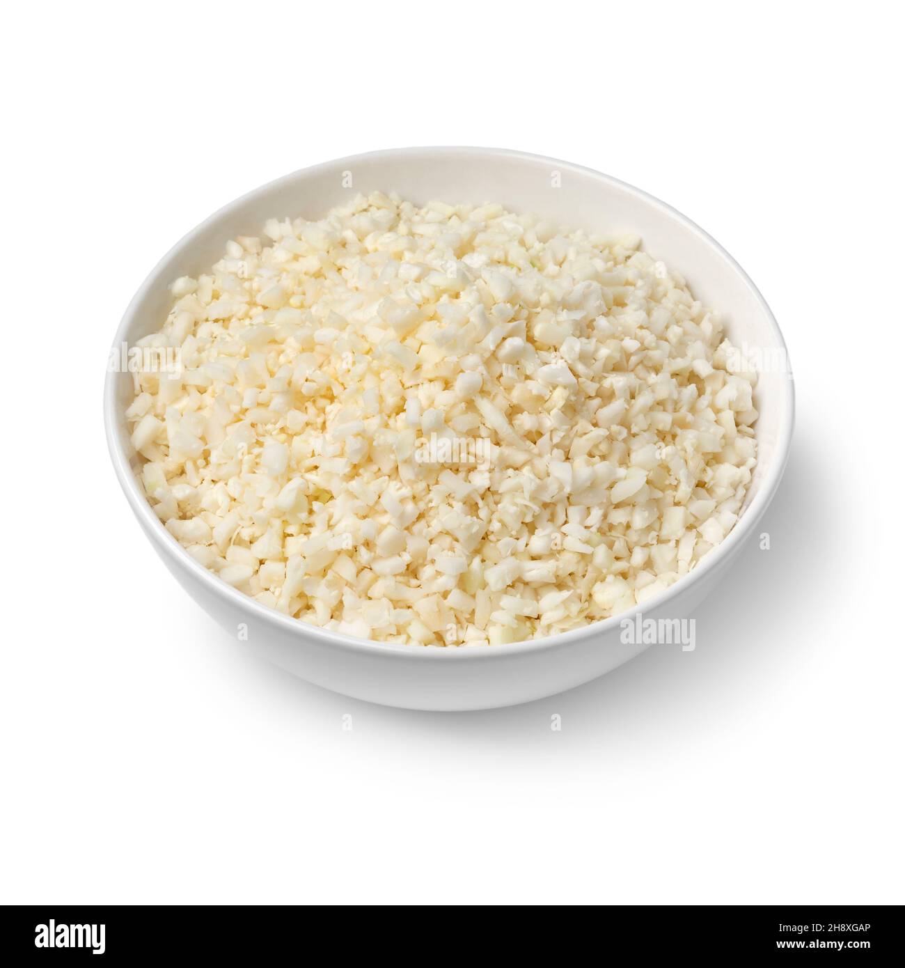 Bowl with fresh raw cauliflower rice isolated on white background Stock Photo