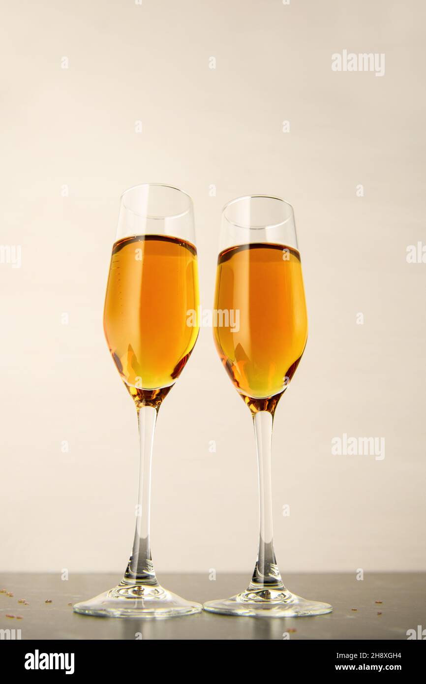 Two glasses of champagne on a gray background. Alcoholic drink: champagne, beer, white wine. New year and Christmas background. Valentine's Day Stock Photo