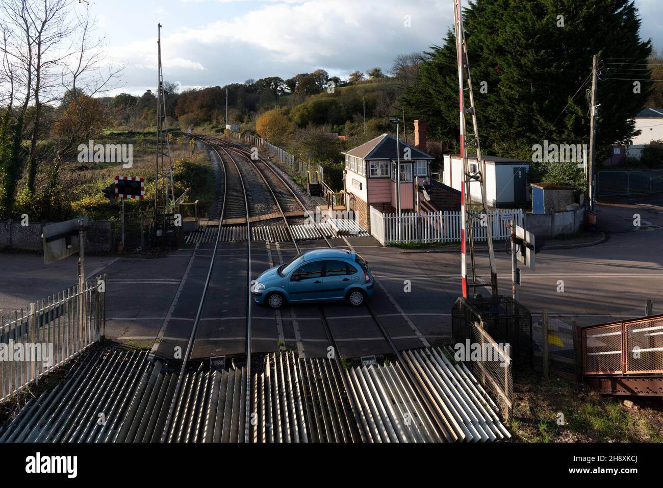 Crediton, Devon, England. 2021. Overview of the level crossing barrier