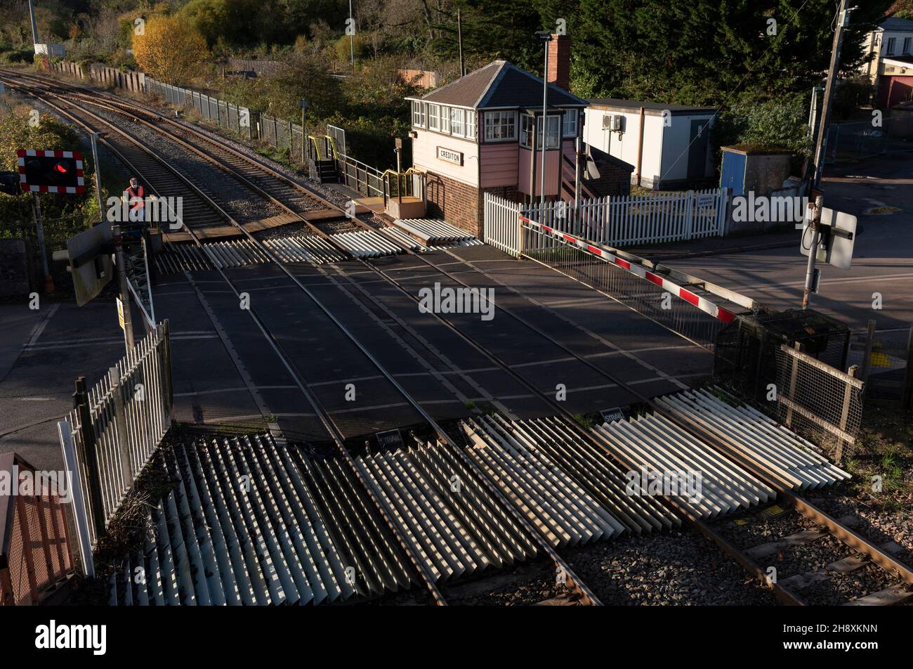 Crediton, Devon, England. 2021. Overview of the level crossing barrier