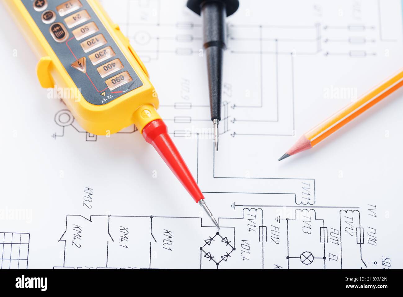 Yellow voltage indicator in closeup on the electrical diagram. Testing