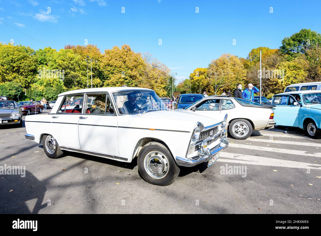 Bucharest, Romania, 24 October 2021: One white Lada vintage car in traffic in a street at an event for vintage cars collections, in a sunny autumn day Stock Photo