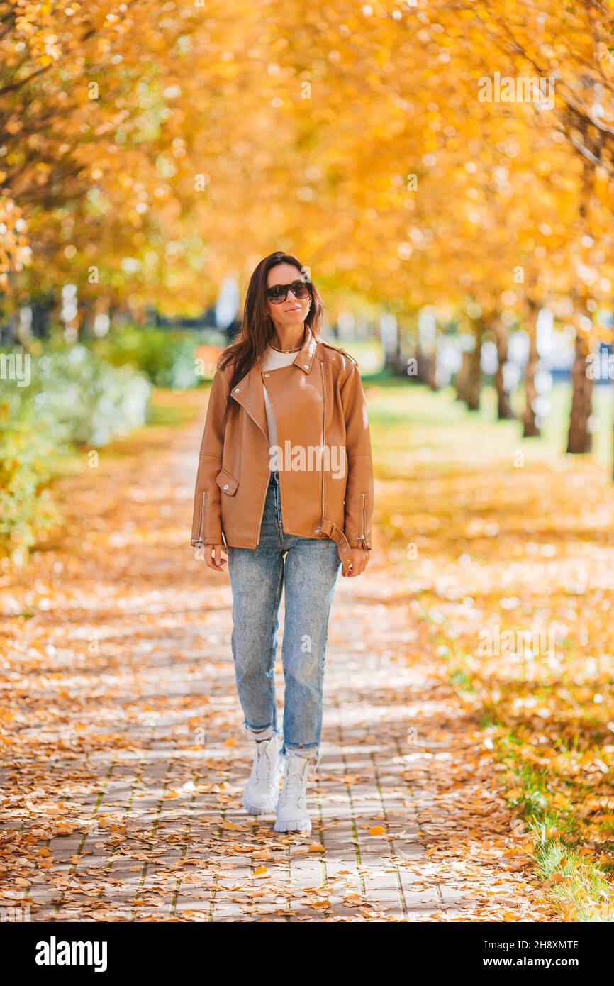 Happy woman in autumn park under fall foliage. Golden autumn park Stock ...