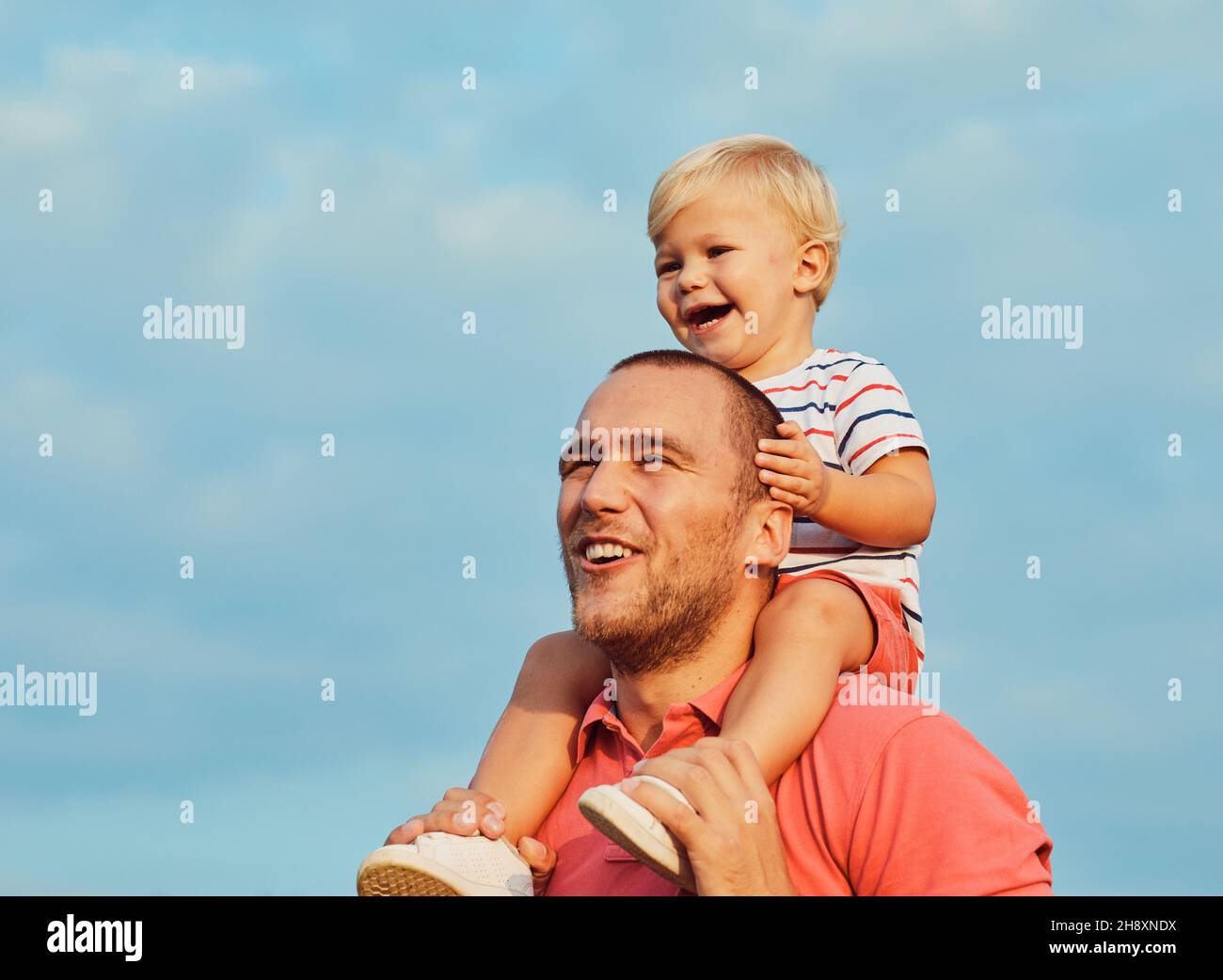child son father family happy playing kid childhood dad love fun smiling little man soap bubble summer love Stock Photo