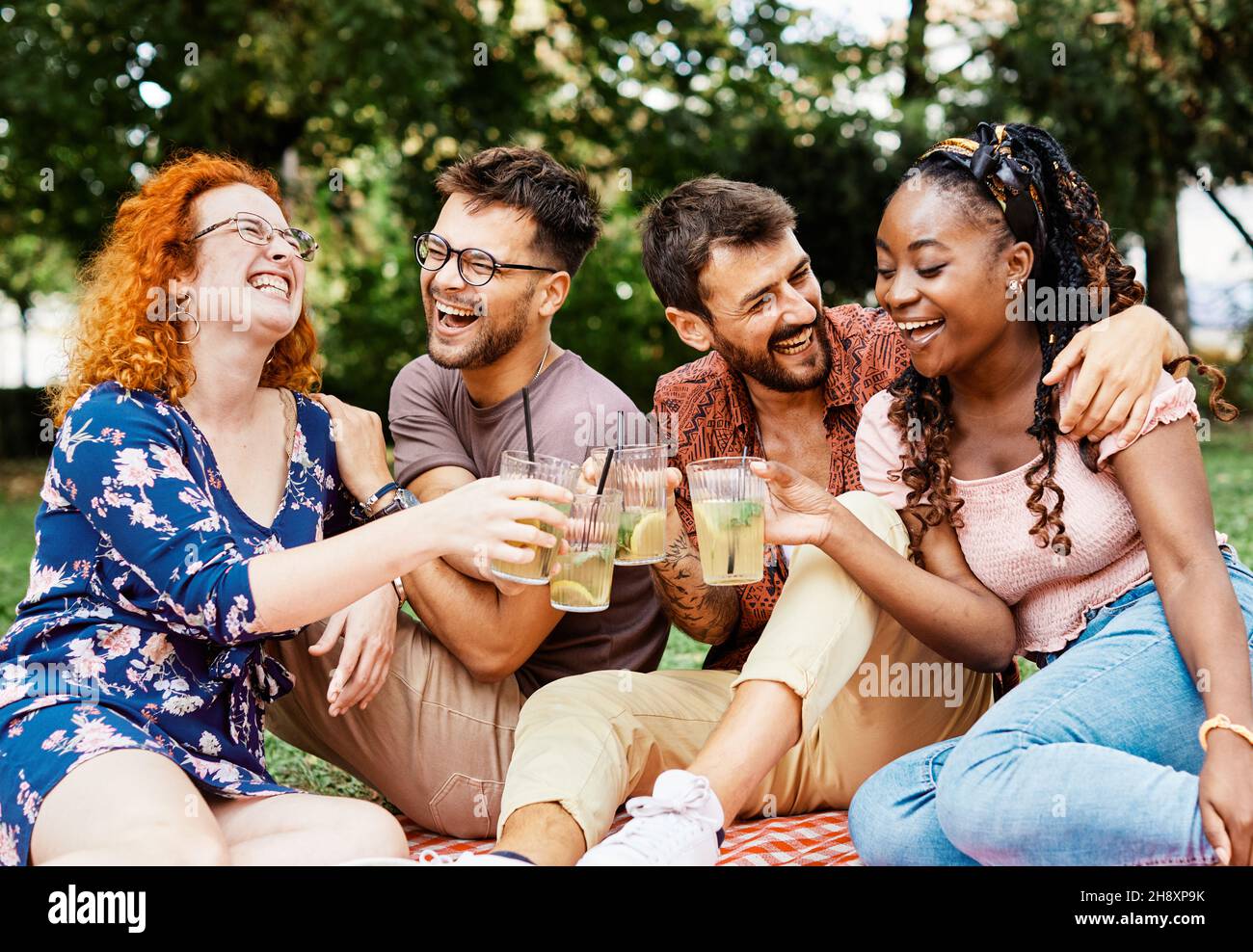 picnic fun outdoor woman friend summer friendship man lifestyle smiling happy toast party couple Stock Photo