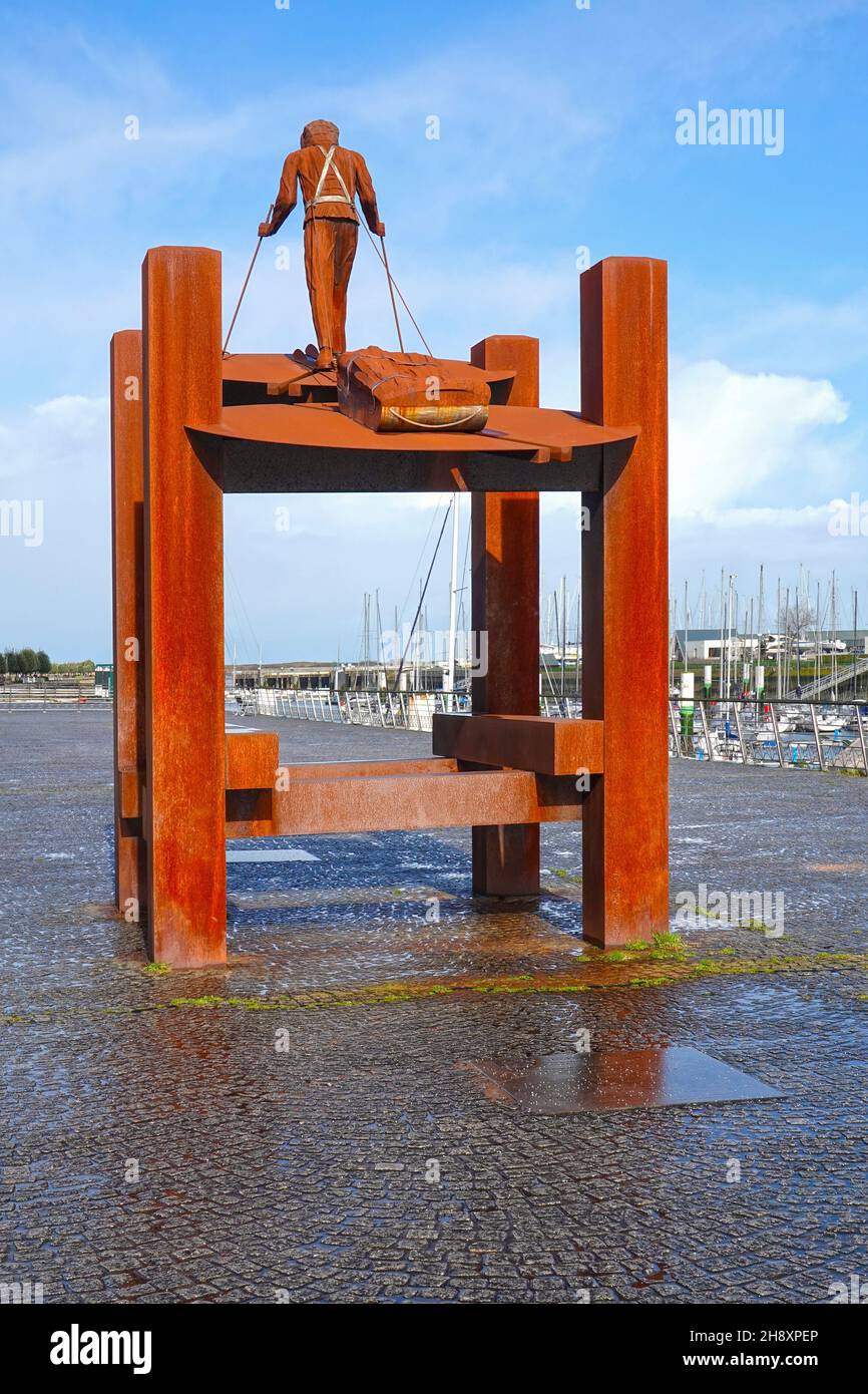 Nieuwpoort, Flanders, Belgium – March 1, 2020: Sculpture of De Poolreiziger, polar explorer, by Freddy Cappon, harbor area of Nieuwpoort at the coast Stock Photo