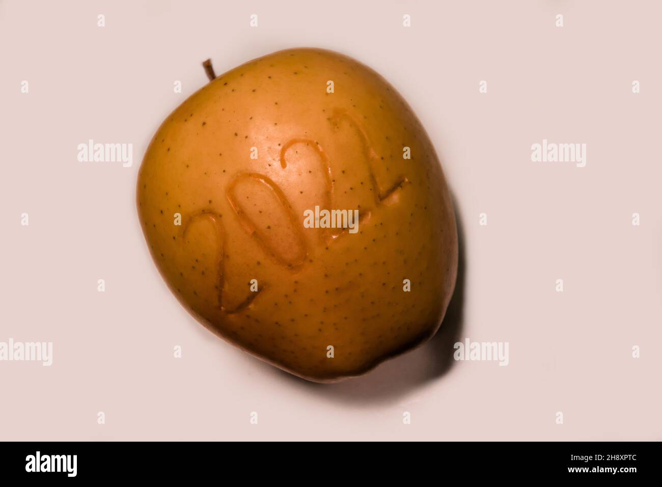Number 2022, placed on an apple, against a white background.  Stock Photo