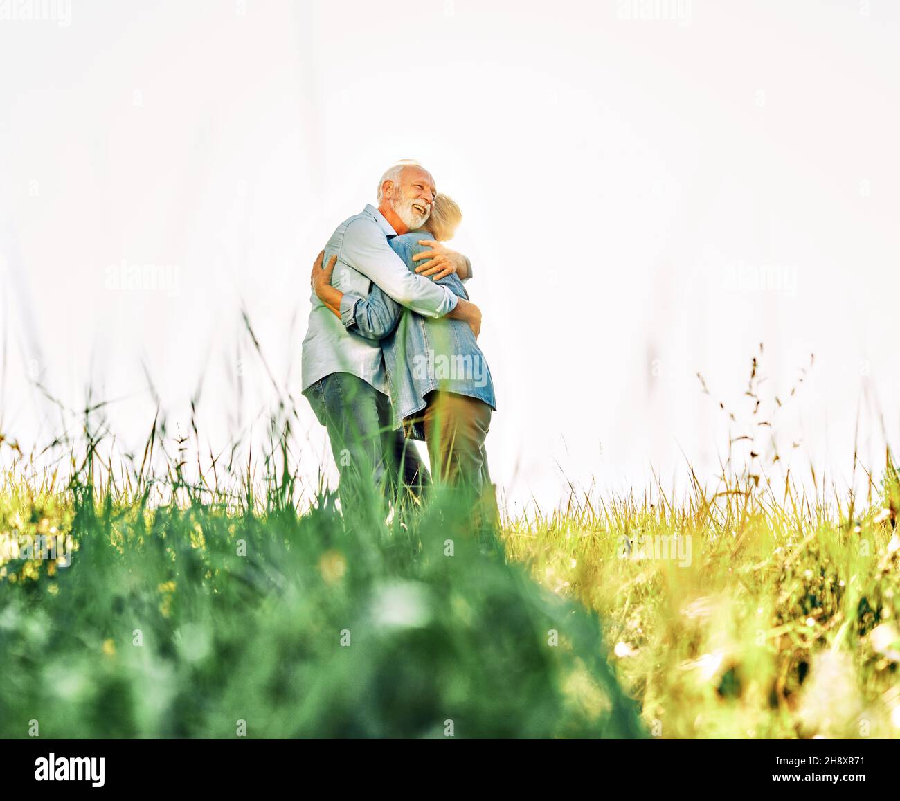 woman man outdoor senior couple happy lifestyle retirement together smiling love hug nature mature Stock Photo