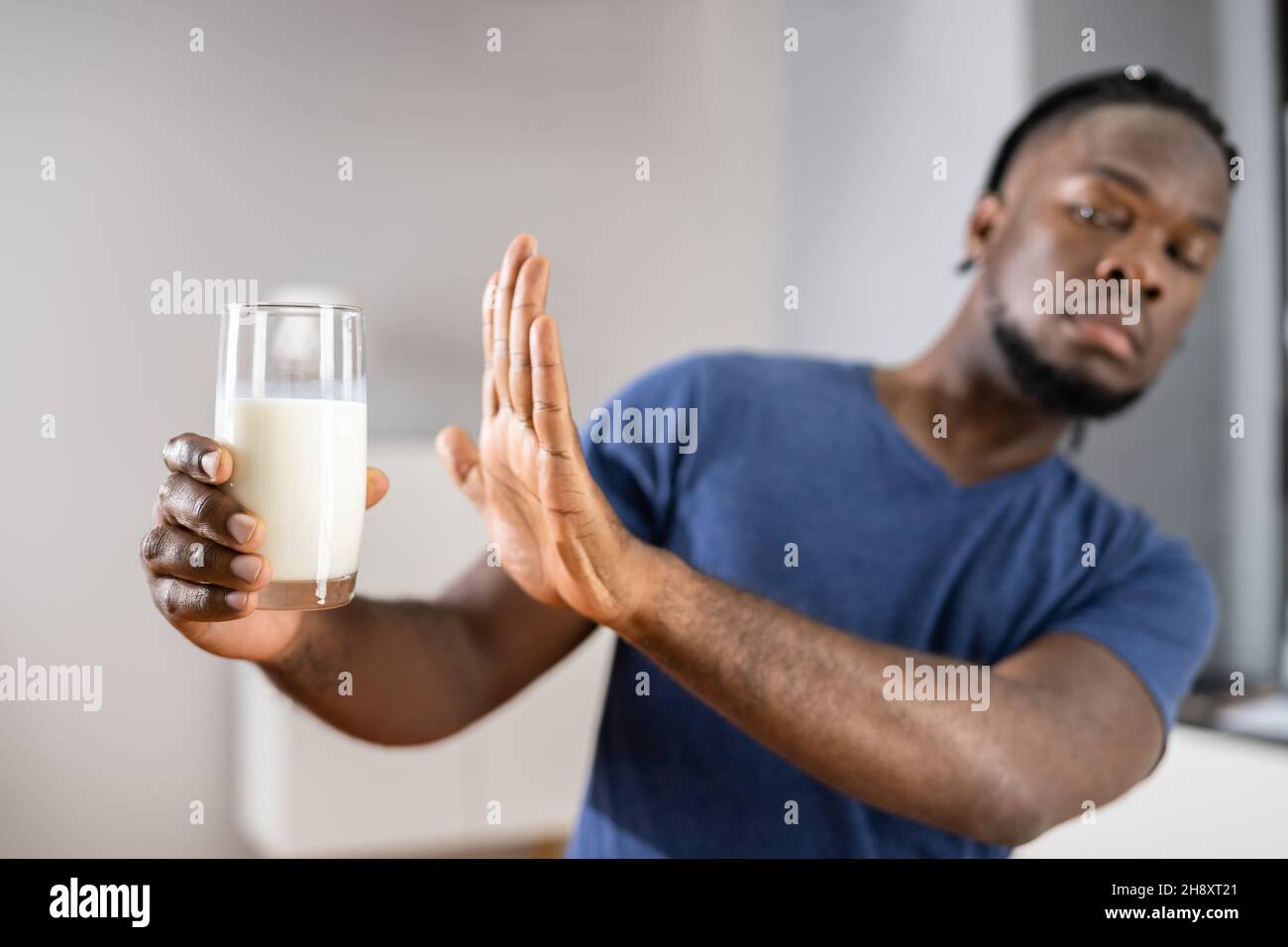 African Male Refusing Milk. Dairy Food Allergy Stock Photo