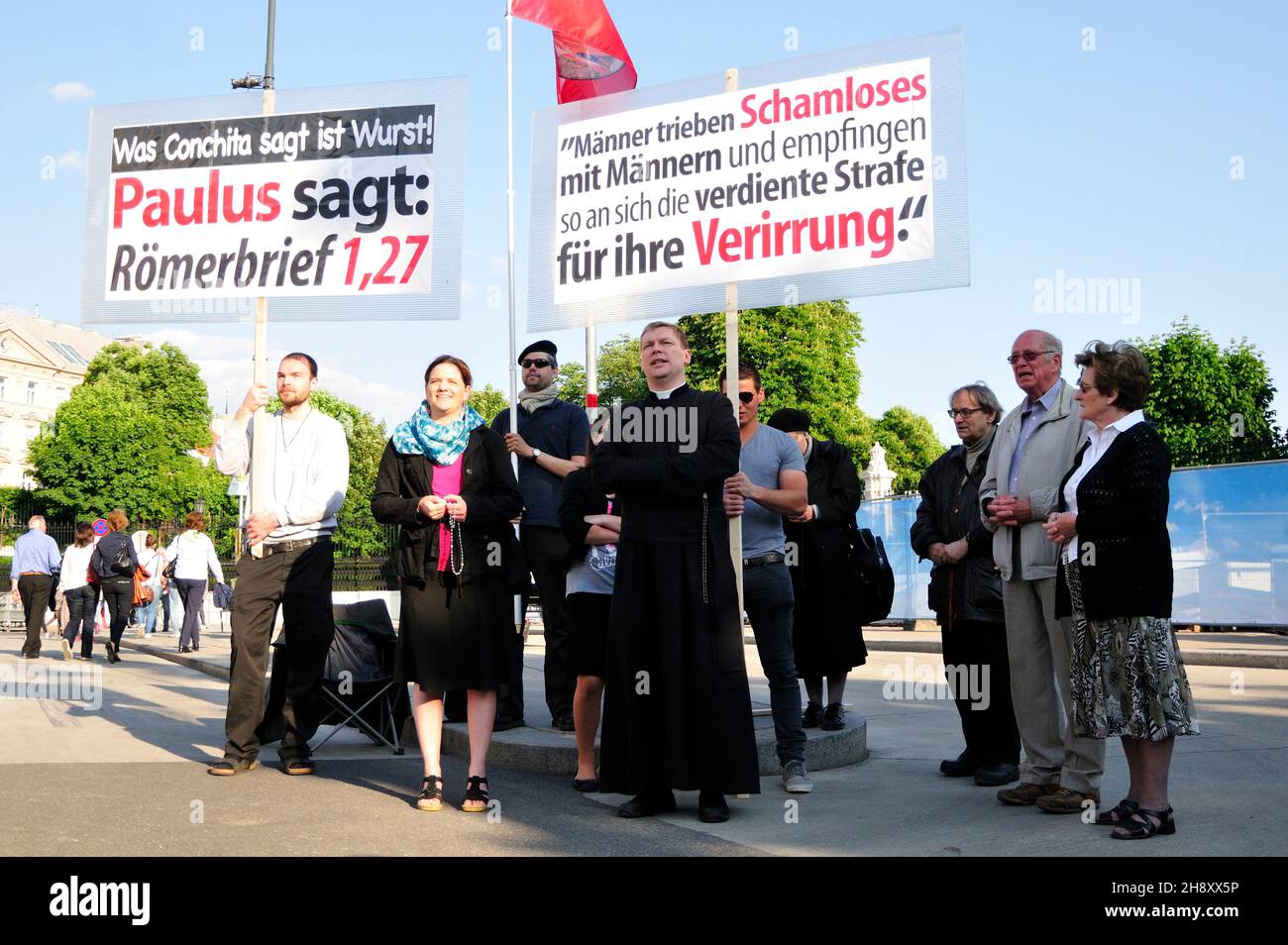 Vienna, Austria. May 16, 2015. Counter-demonstration to the Life Ball. Board with the inscription 'What Conchita says is sausage. Paul says: Romans 1.27 Stock Photo
