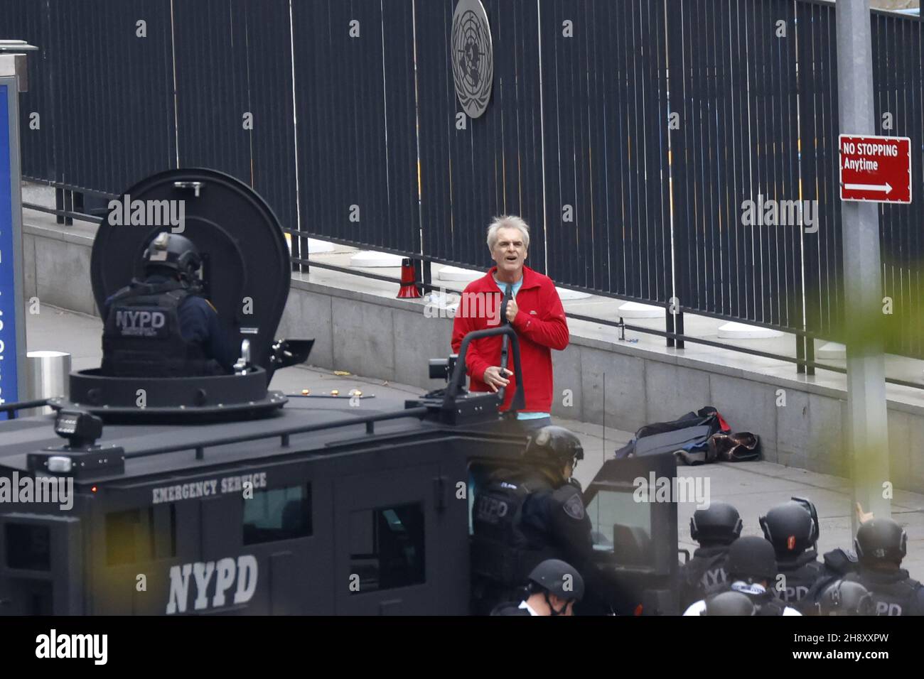 New York, United States. 02nd Dec, 2021. New York Police Department officers patrol the outside of the UN building complex during a standoff with a gunman (red coat) in New York on Thursday, December 2, 2021. The gunman surrendered. Photo by John Angelillo/UPI Credit: UPI/Alamy Live News Stock Photo