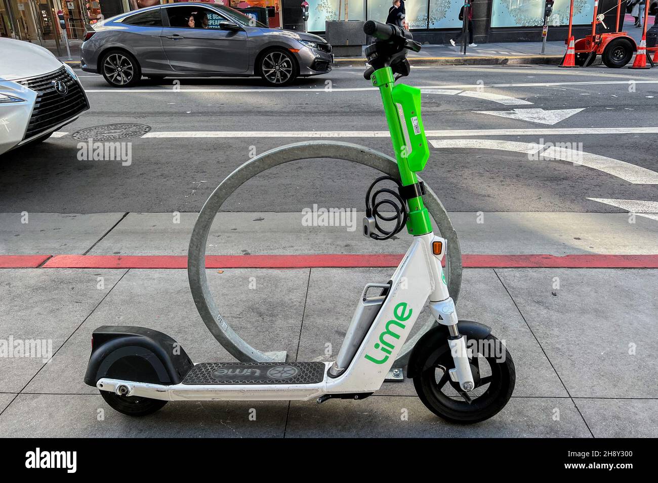 A Lime scooter is parked on a San Francisco street on Nov. 22, 2021. Lime is a transportation