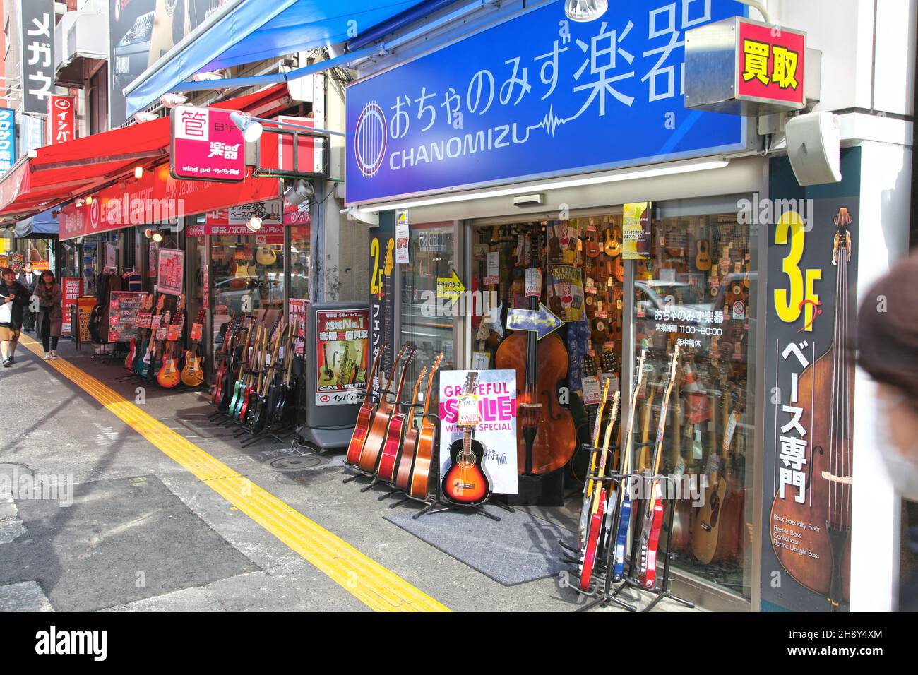 Guitar and other musical instrument shops and stores line both sides of Ochanomizu Street in