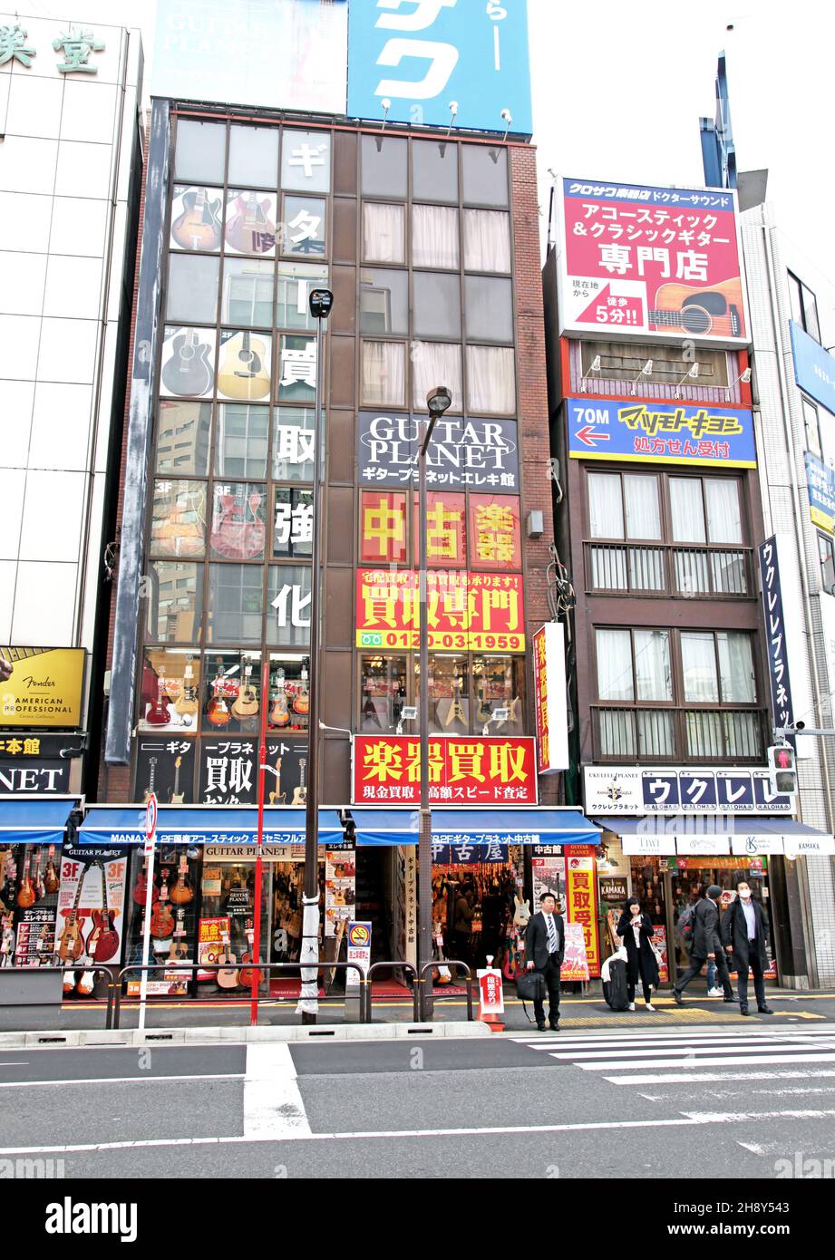 Guitar and other musical instrument shops and stores line both sides of Ochanomizu Street in