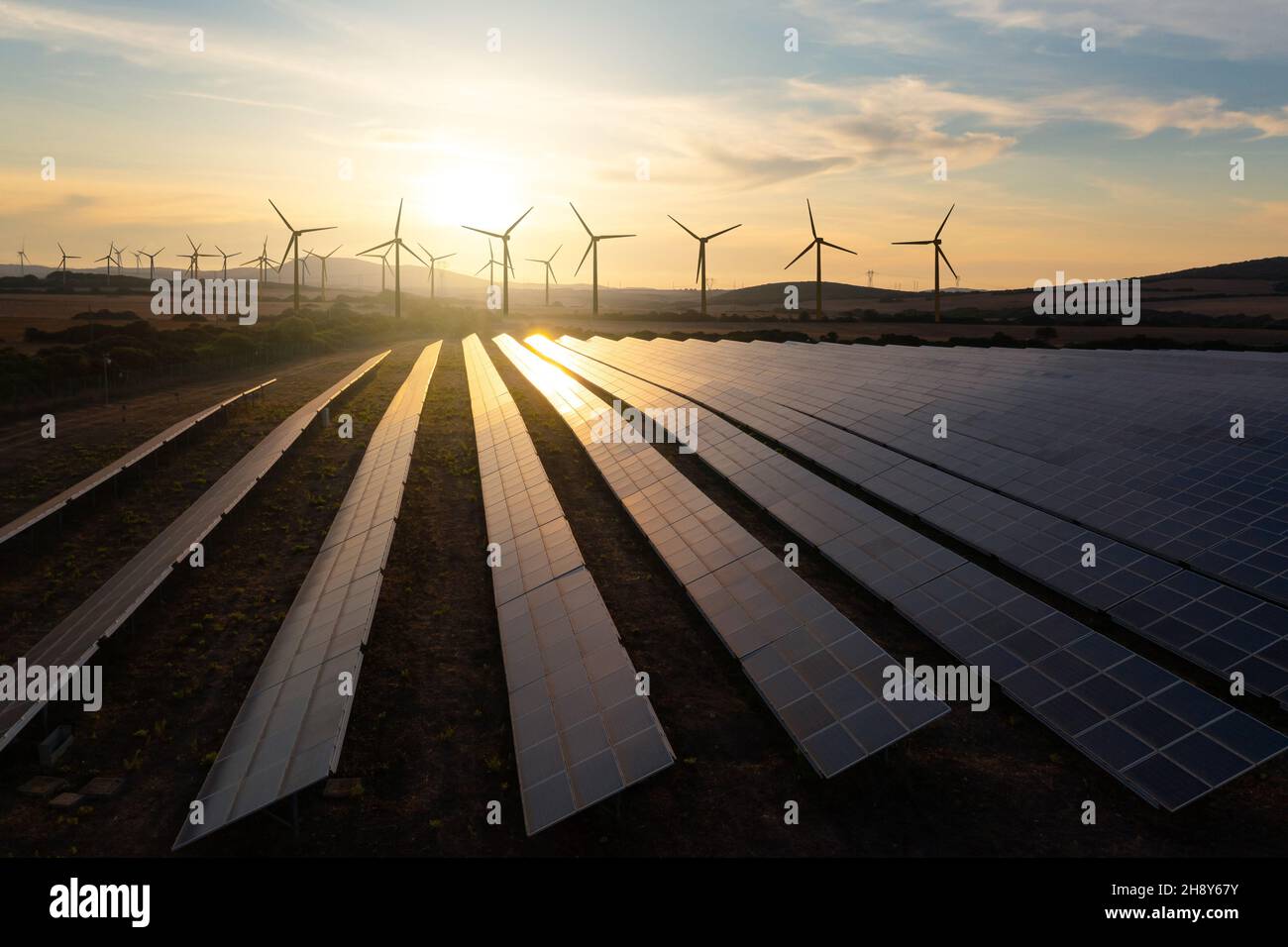 Solar panels and wind turbines generating renewable energy for green ...