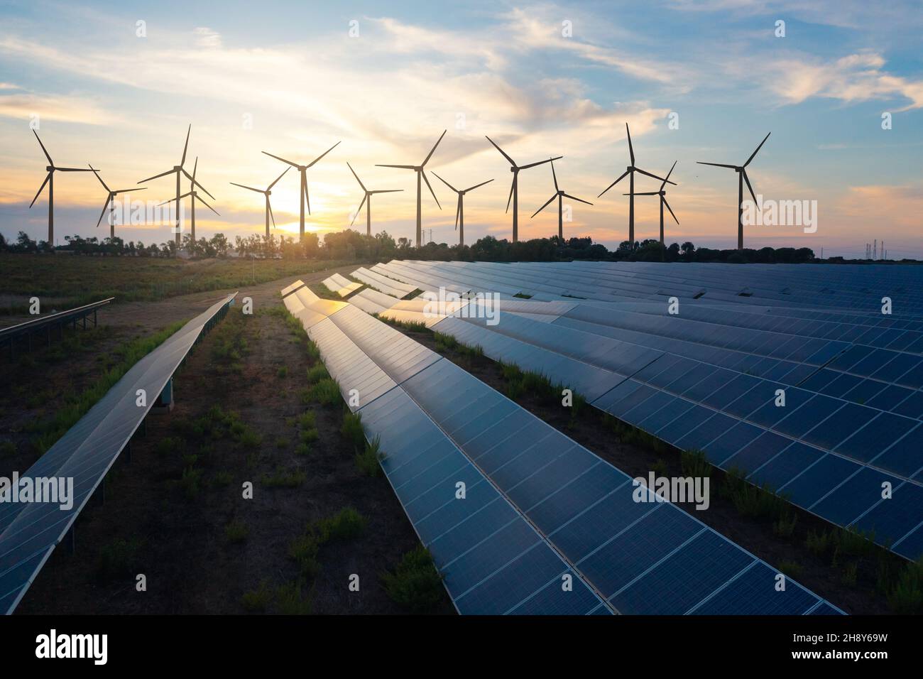 Solar panels and wind turbines generating renewable energy for green ...