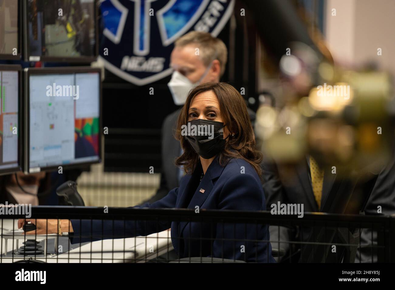 Greenbelt, United States of America. 05 November, 2021. U.S Vice President Kamala Harris, center, uses a controller to manipulate one of the robotic arms at the Robotic Operations Center inside Goddard Space Flight Center, November 5, 2021 in Greenbelt, Maryland.  Credit: Taylor Mickal/NASA/Alamy Live News Stock Photo