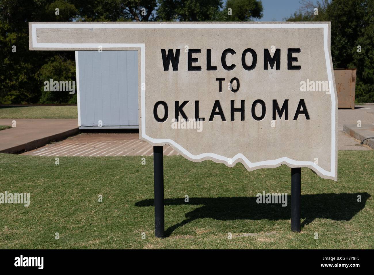 to Oklahoma cement sign in the shape of the state Stock Photo