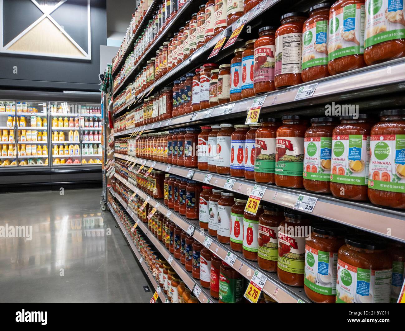 Kirkland, WA USA - circa September 2021: Angled view of jars of pasta in the pantry aisle inside a QFC grocery store. Stock Photo