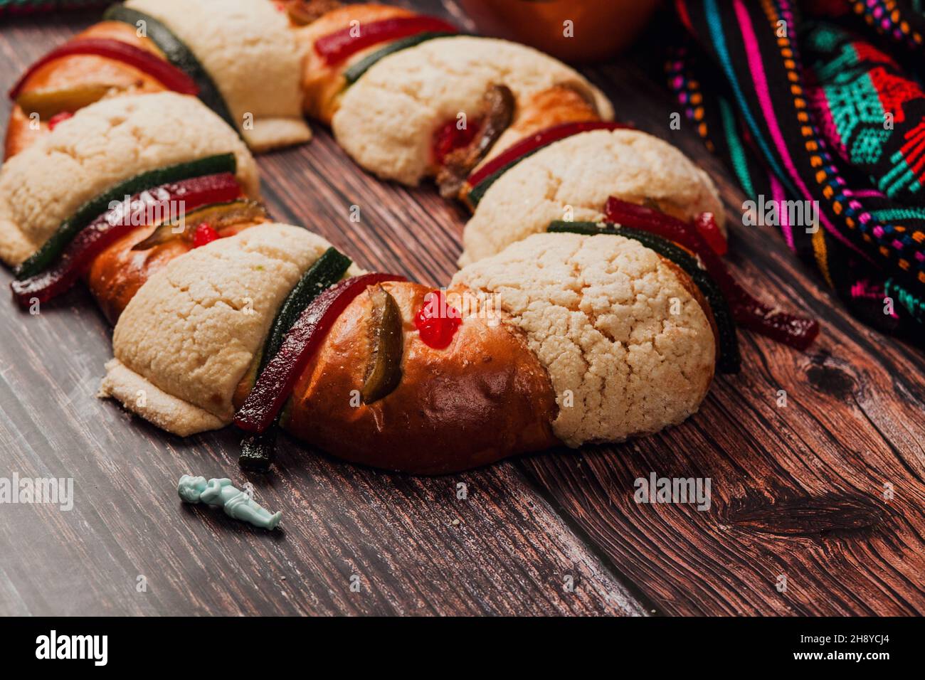 Rosca de reyes or Epiphany cake for kings day on wooden table in Mexico Latin America Stock Photo