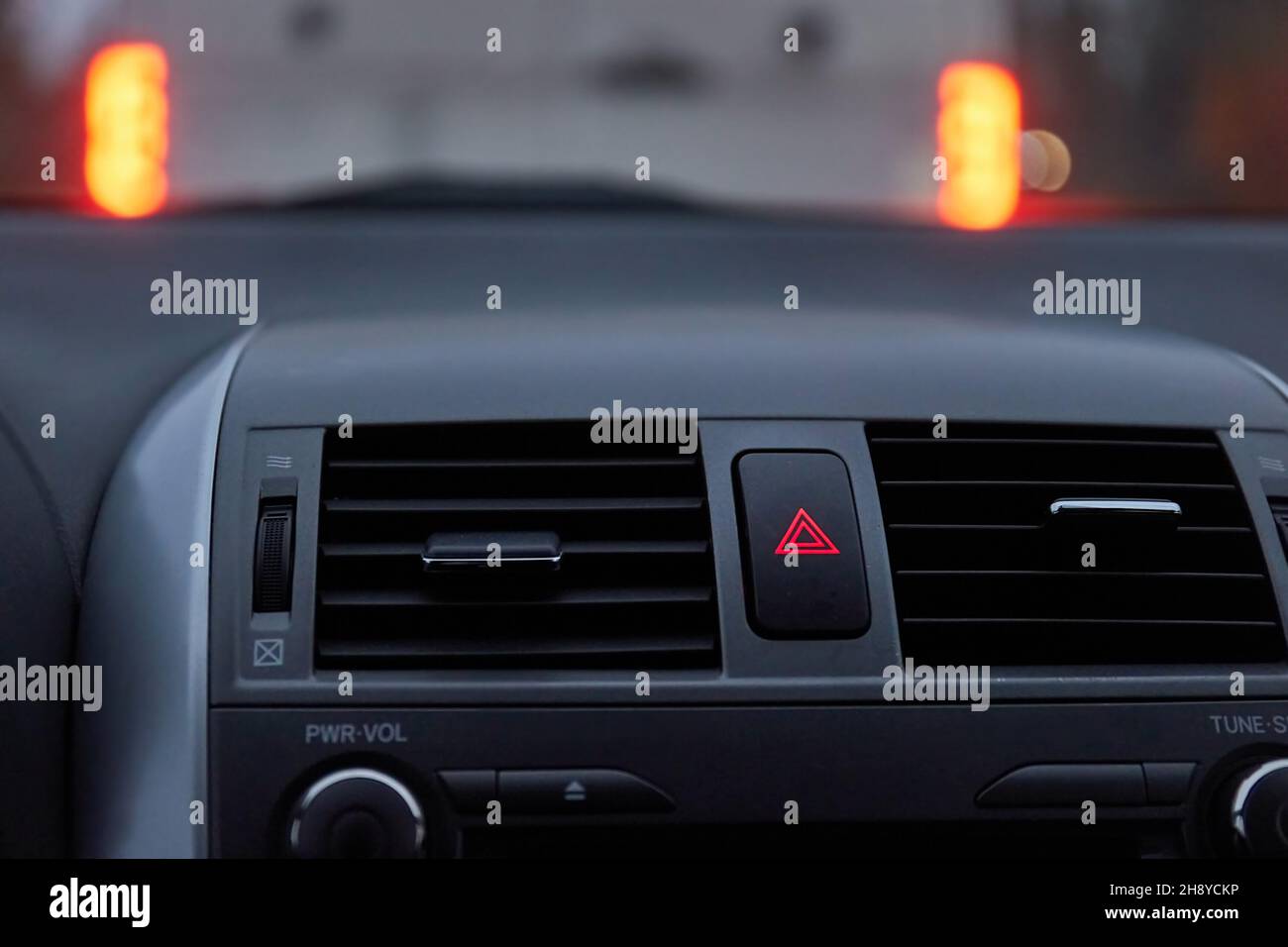 Dashboard hazard light button in stopping traffic Stock Photo Alamy