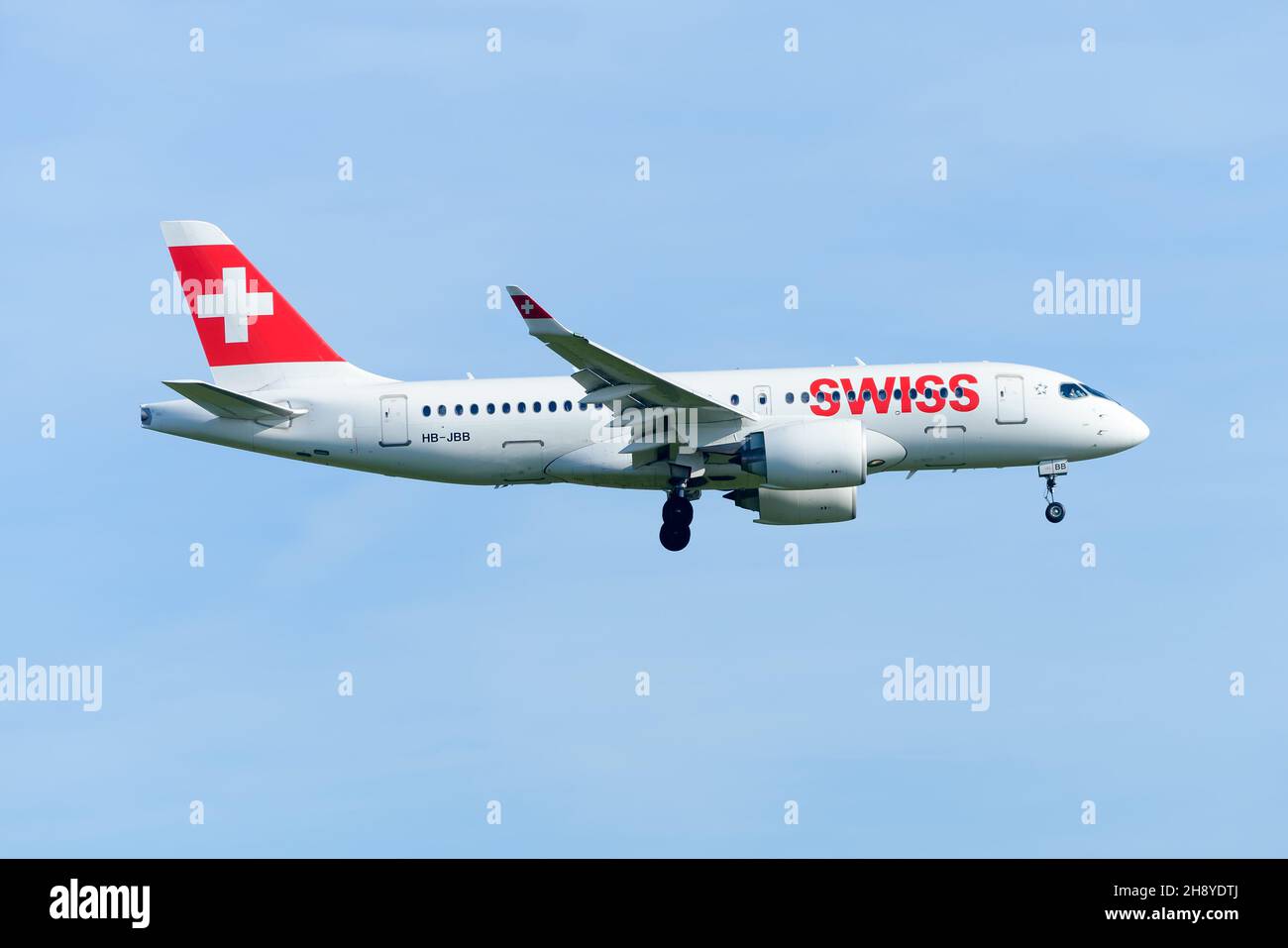 Swiss Airlines Airbus A220 CS100 aircraft landing. New modern airplane CSeries of Swiss Air Lines flying. Stock Photo