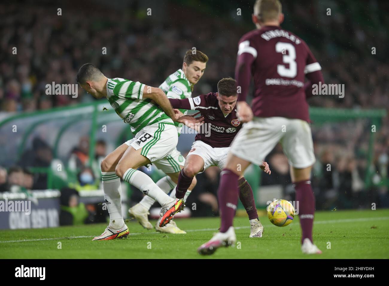 Glasgow, Scotland, 2nd December 2021.  James Forrest of Celtic and Cameron Devlin of Heartsduring the Scottish Premier League match at Celtic Park, Glasgow. Picture credit should read: Neil Hanna / Sportimage Stock Photo