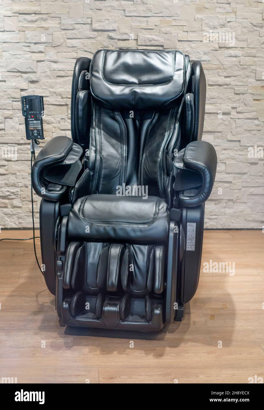 Black robotic massage chair Stock Photo