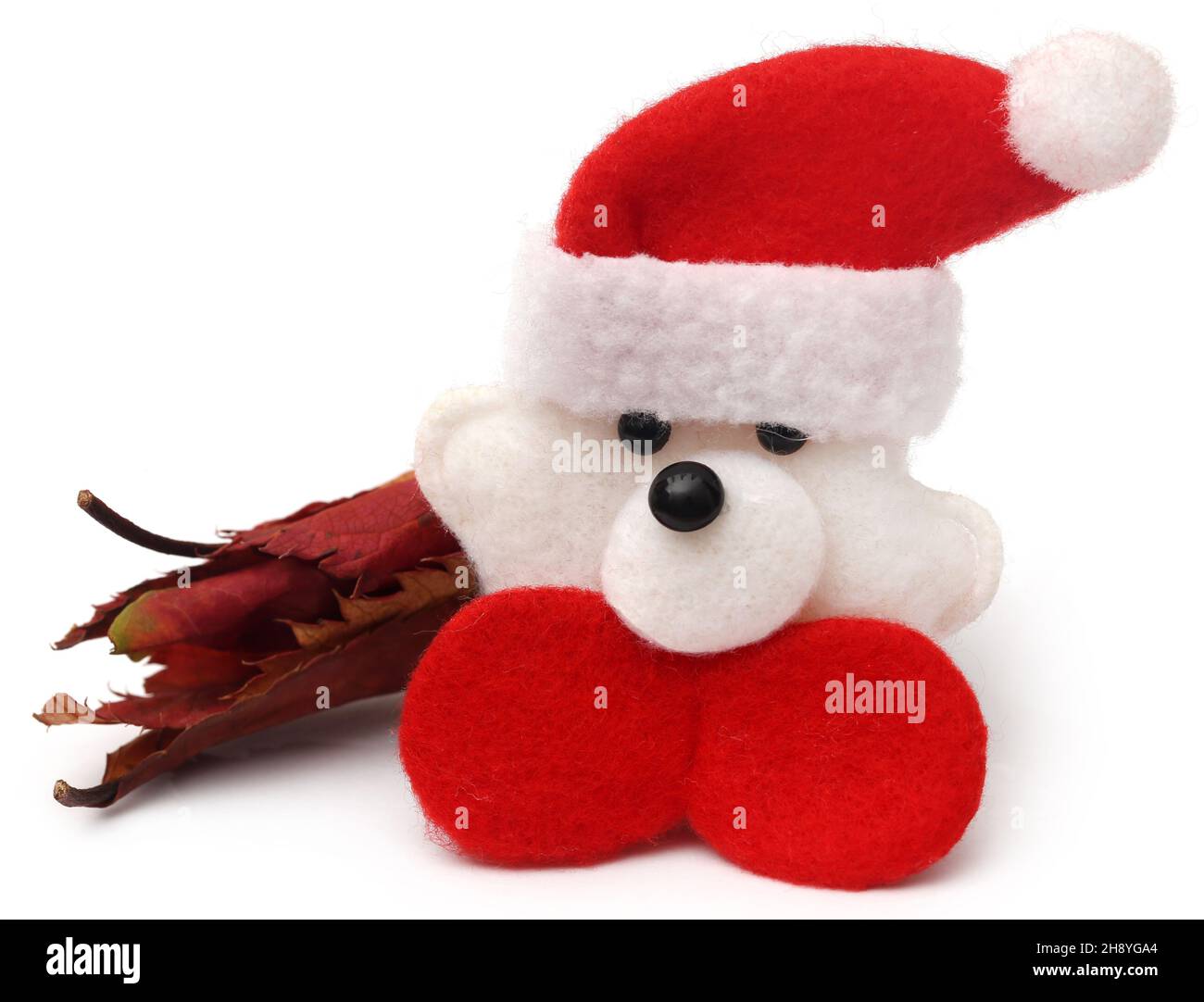 Dry rose buds with santa claus as symbols of Christmas Stock Photo