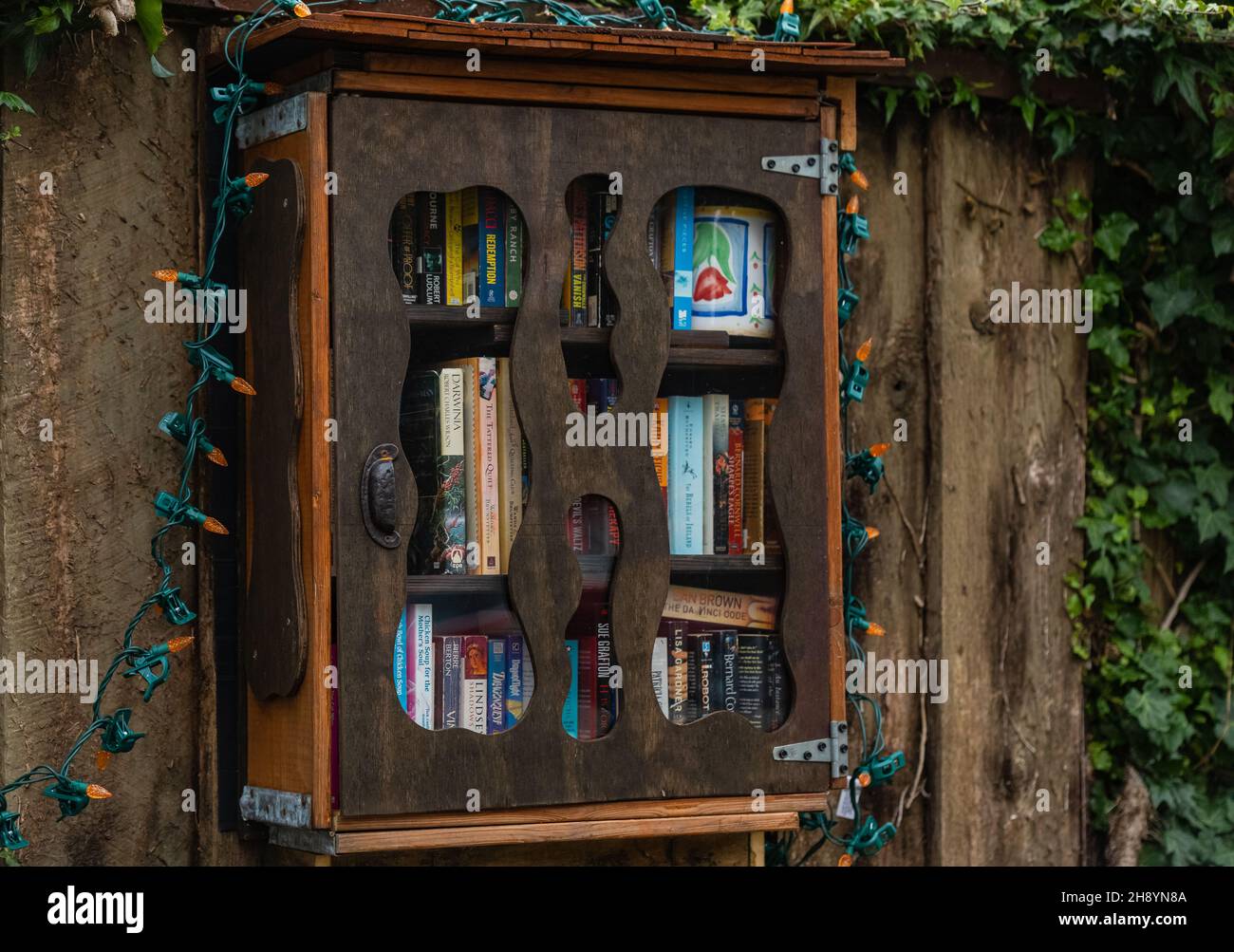The library shelf of the neighborhood. Small street library for free