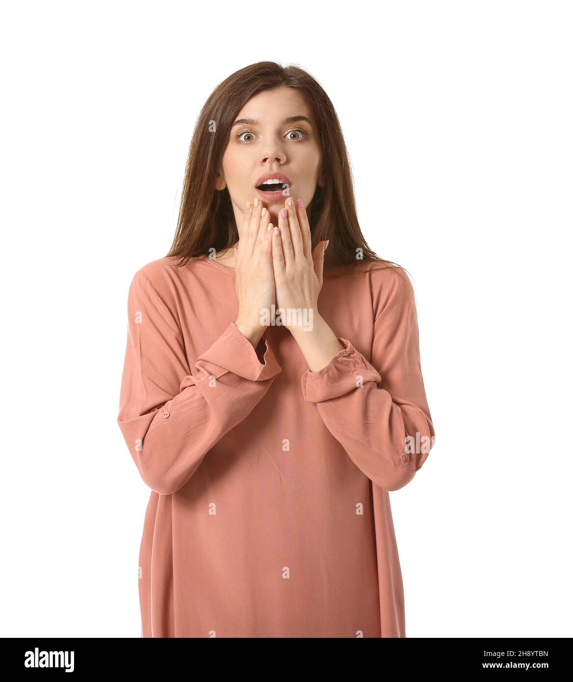 Young surprised woman on white background Stock Photo - Alamy