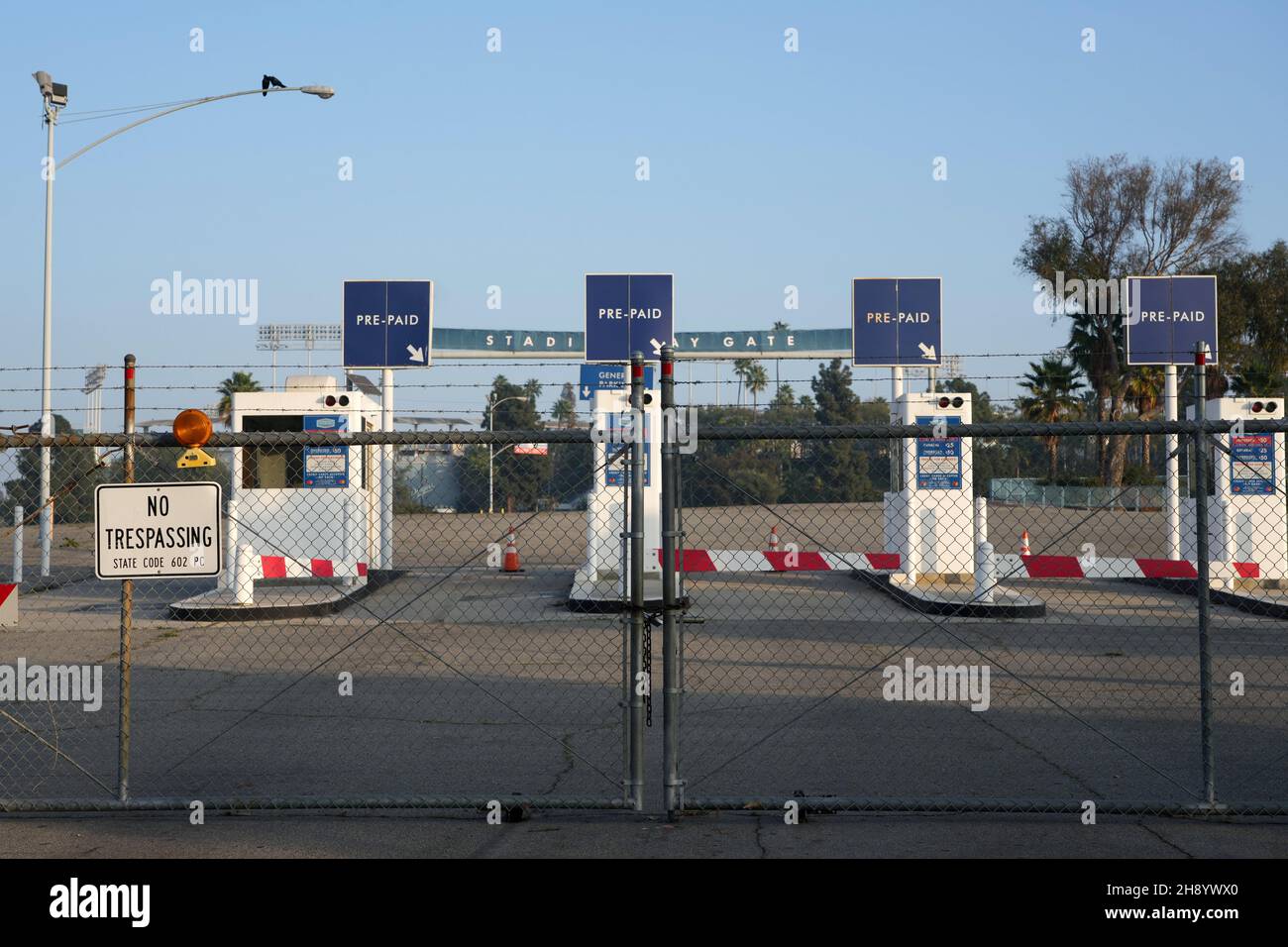 closed-and-locked-gates-at-dodger-stadium-thursday-dec-2-2021-in-los-angeles-amid-the-expiration-of-major-league-baseballs-collective-bargaining-2H8YWX0.jpg
