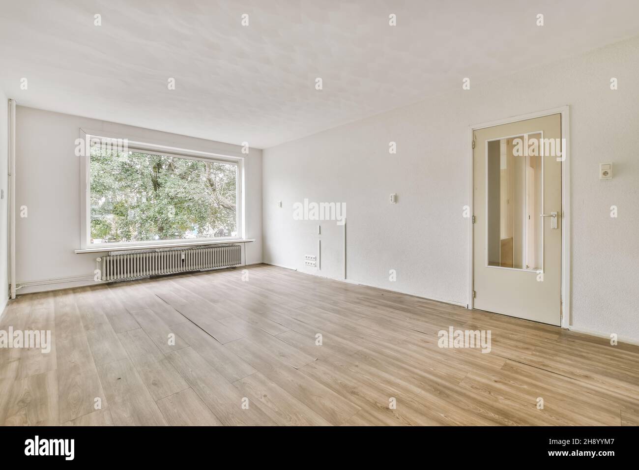 A breathtaking daylight room with a large window Stock Photo - Alamy